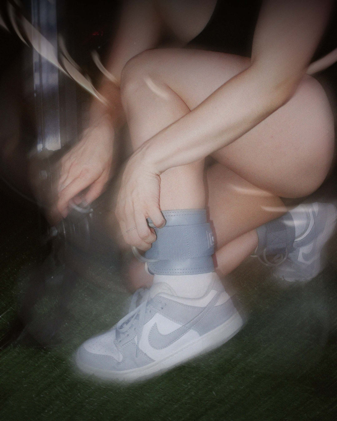 woman putting on uppper ankle straps