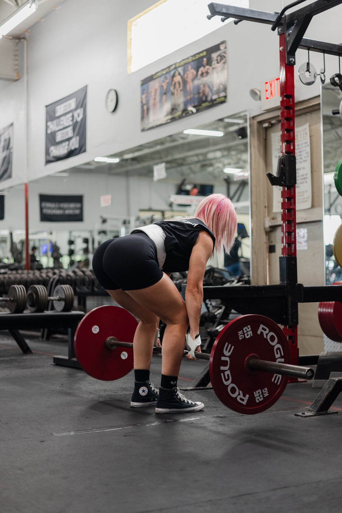 woman doing hamstring exercise using uppper lifting gear