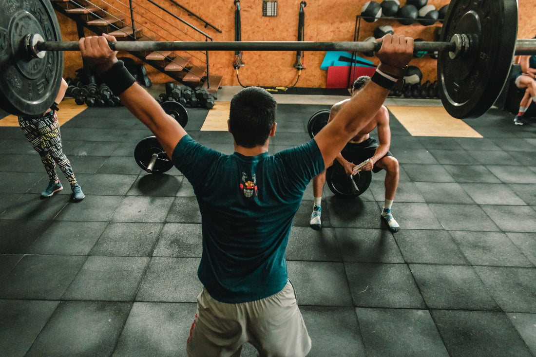 man doing clean and jerk