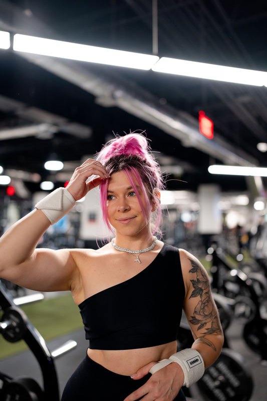 woman at the gym wearing uppper wrist wraps